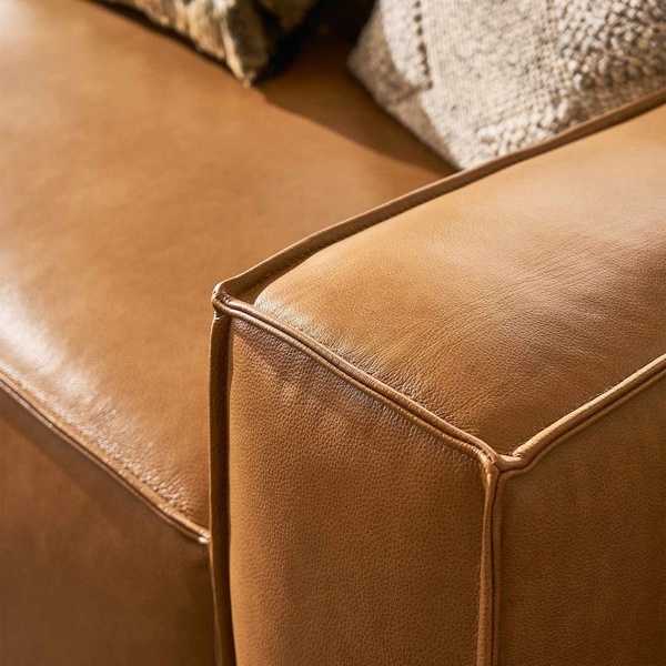 leather sofa, tan sofa, leather couch, living room furniture, sofa seating, brand awareness, minimalist, lifestyle, luxurious, calm, brown, neutral
